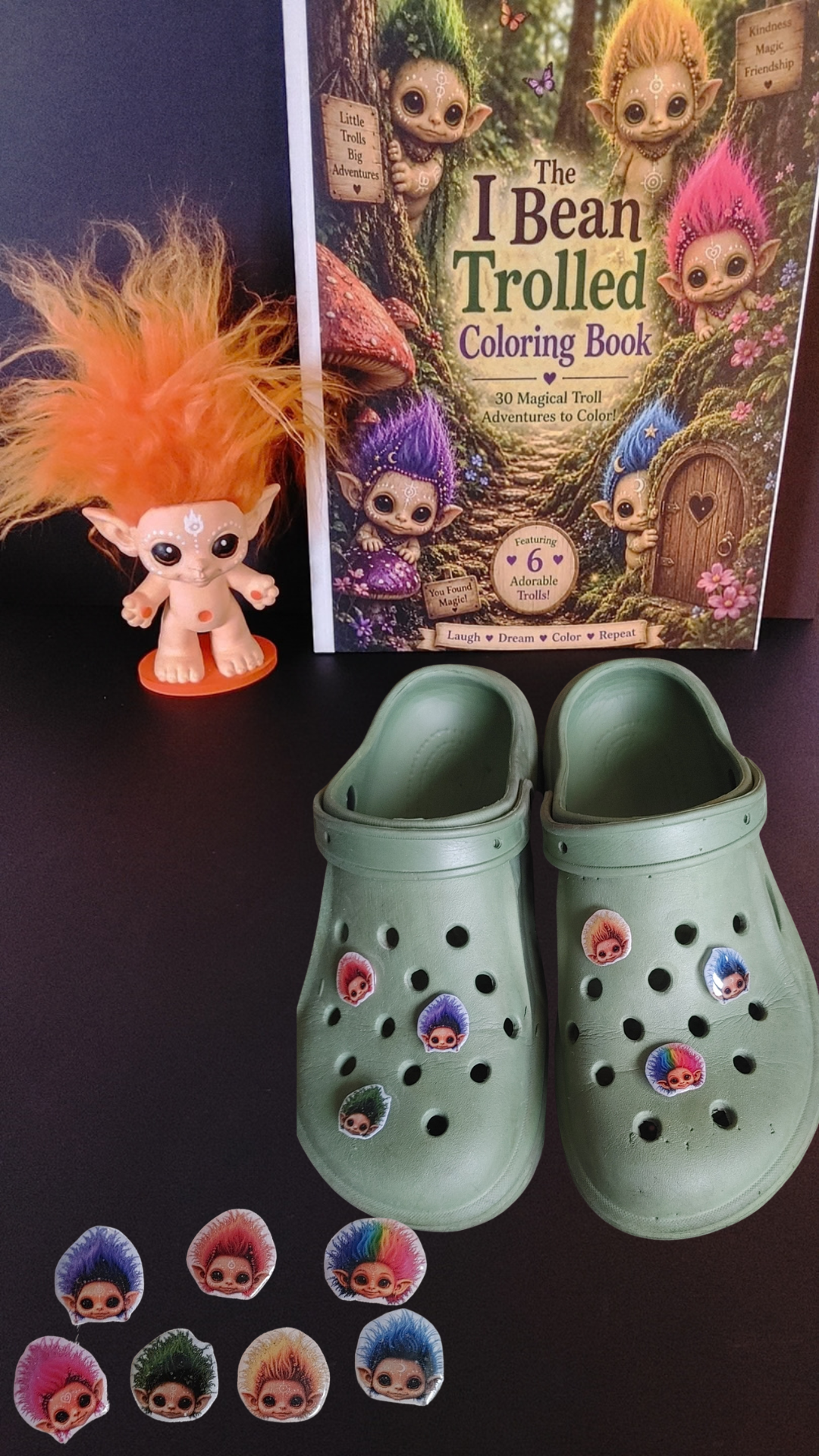 Handmade Celestial Troll shoe charms displayed on green shoes